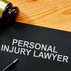 personal injury lawyer book and a gavel - Axion Law Group